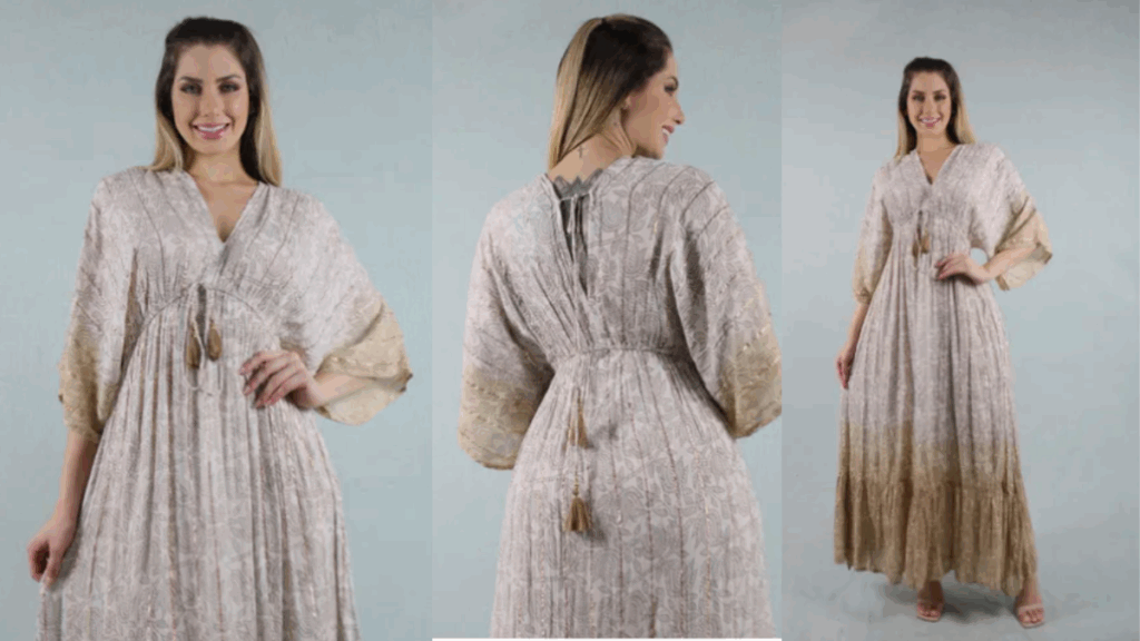“Vestido longo dourado com manga morcego, estampa sofisticada e bordados delicados, ideal para casamentos, festas e formaturas.”