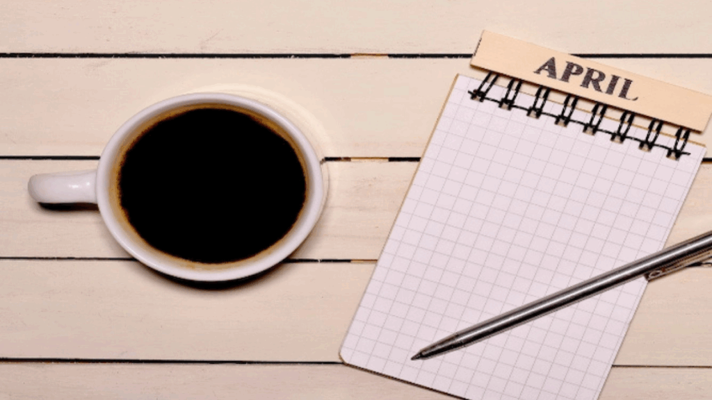 Xícara de café fumegante sobre uma mesa rústica, simbolizando a celebração do Dia Mundial, Internacional e Nacional do Café e a tradição dessa bebida apreciada no Brasil e no mundo.