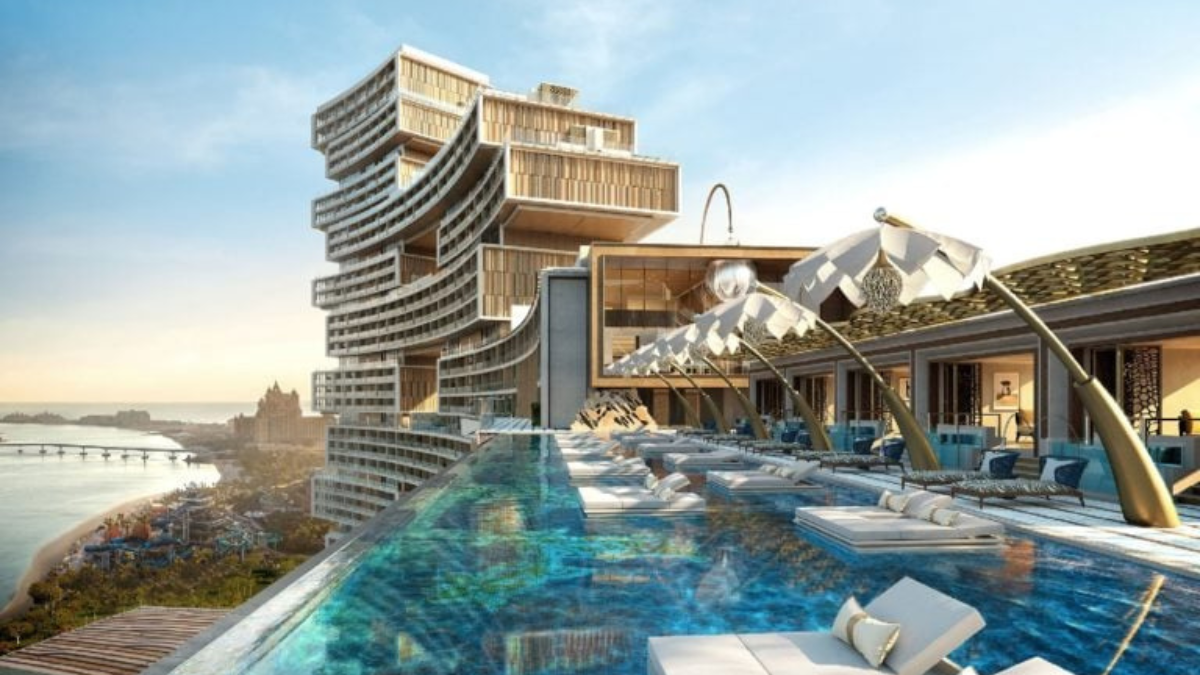 Imagem ilustrativa de um hotel de luxo moderno, com arquitetura sofisticada, paisagens naturais deslumbrantes e ambientes exclusivos que representam a nova geração da hotelaria premium em 2025.
