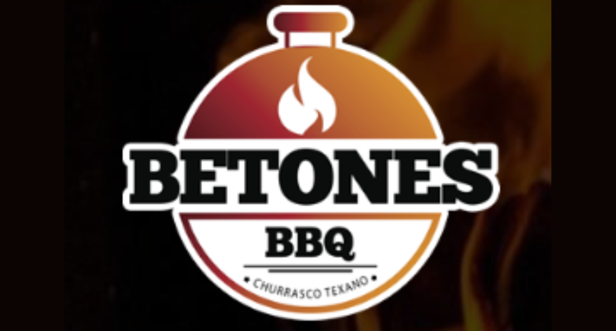 Premium Brazilian barbecue on a charcoal grill featuring picanha, ribs, and perfectly seared cuts with rich marbling.